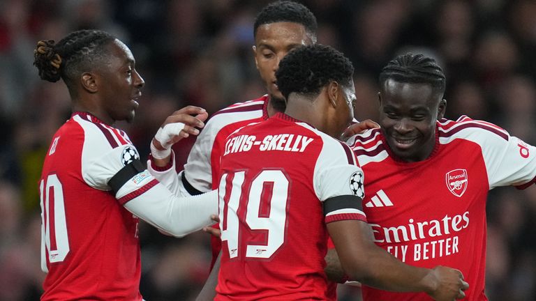 Bukayo Saka celebrates with Arsenal teammates during the 3–0 win over Lille on 13 October 2026