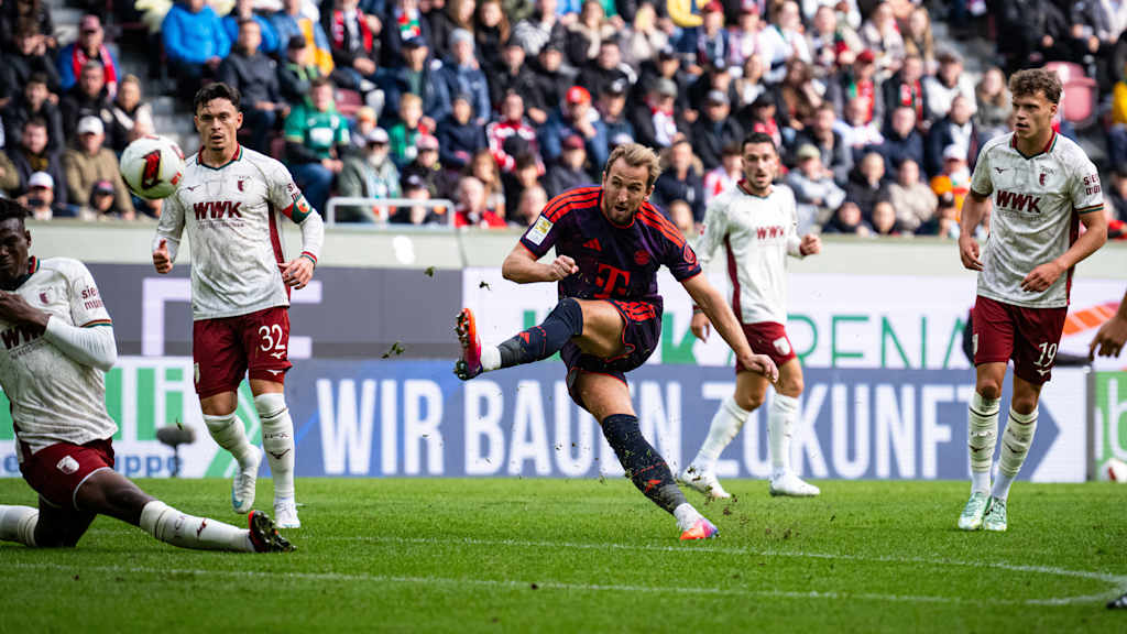 Harry Kane strikes the ball during Bayern’s away match at Augsburg.