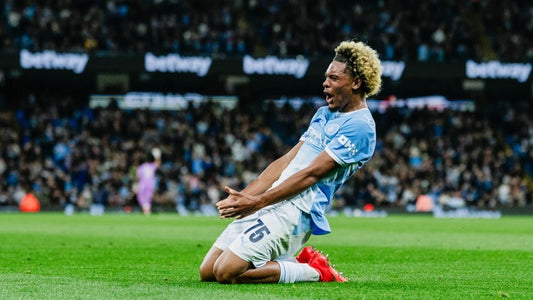 Floyd Samba celebrating with a knee slide after scoring for Manchester City against Norwich City on 17 September 2026